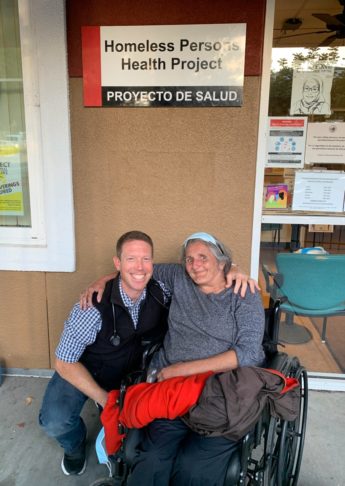 Stephen Pasquini, PA-C, with a patient outside the Homeless Persons Health Project